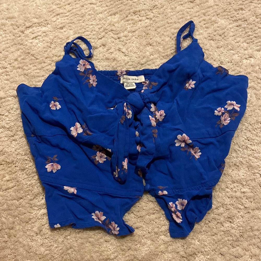 American Eagle royal blue crop top with white and pink flower design.